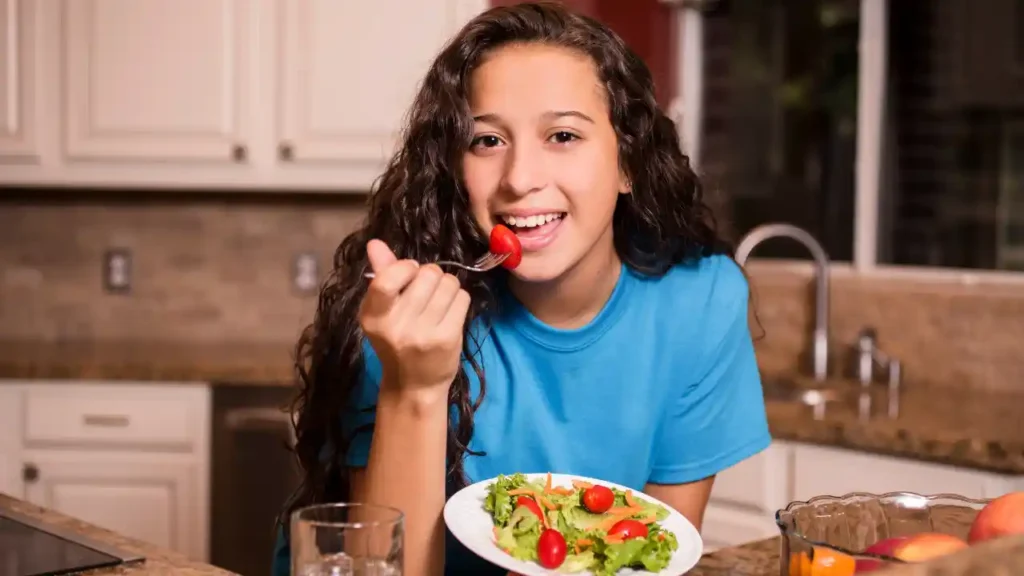 Calorie Basics for Teens: Growth, Energy & Health Guide Every week in my nutrition classes in Denver, Colorado, I meet teenagers who are confused about calories. Some think calories are the enemy. Others eat whatever they want and never think about fuel. Understanding calorie basics for teens, what they are, why you need them, and how many you actually need, is one of the best things a young person can learn. This guide covers everything in plain language. No complicated science. No shame. Just real, helpful information that supports your growth, energy, and long-term health.  What Are Calories and Why Teens Need Them Calories are not the enemy. For teenagers, they are building blocks. Full stop. Let me explain that in a way that actually makes sense. What Is a Calorie? (Simple Explanation) A calorie is a unit of energy. Every bite of food you eat gives your body energy to work. That energy comes from calories. According to the National Institutes of Health, calories power everything from your heartbeat to your breathing to your ability to think clearly during a test. Here is a simple way to think about it: calories are like battery power for your body. When you run low, everything slows down. You know that hollow stomach feeling at 10:45 AM? That is low energy. The brain fog during algebra when you skipped breakfast? Low energy. Snapping at your best friend because you did not eat lunch? Also low energy. Calories prevent all of that. Calories are found in all foods and drinks They power your heartbeat, breathing, thinking, and movement Without enough calories, your body slows down and struggles Too few calories is just as harmful as too many Why Teens Need More Calories Than Adults Here is something most people do not realize: teenagers actually need MORE calories than many adults. According to the Centers for Disease Control and Prevention, your body is under serious construction during your teen years. Think of it this way. Your body is building new muscle. Your height is increasing. Your hormones are shifting. Your brain is developing. All of that construction requires materials. Calories are those materials. Growth spurts demand extra energy Hormonal changes during puberty use calories Muscle development requires fuel Brain development peaks in the teen years Daily activities, school, sports, social life, all burn energy Adults have already built most of those systems. You have not. So the idea that a teenager should eat less than an adult is simply wrong. Your needs are higher, not lower. Calories Support More Than Body Weight This is the part people always miss. Calories do not just affect how you look or how much you weigh. They affect almost everything about how you feel day to day. Mood regulation, low calorie intake is directly linked to irritability and anxiety Focus in school, your brain needs glucose from food to concentrate Hormonal balance, severe calorie restriction disrupts puberty hormones Sleep quality, underfueled teens often sleep worse Athletic performance, no fuel means no power When I work with teenagers who are struggling with focus or mood, the first thing I ask about is what they have eaten that day. You would be surprised how often the answer is "almost nothing." How Many Calories Do Teens Actually Need? This is the big question. The honest answer? It depends. And I mean that in a useful way, not a frustrating way. Let me break it down for you. Factors That Affect Teen Calorie Needs According to the Academy of Nutrition and Dietetics, several key factors determine how many calories a teenager actually needs each day. Age, your needs change as you move through your teen years Sex assigned at birth, biological differences affect metabolism and growth Height and weight, taller and heavier bodies burn more energy Activity level, an active teen needs significantly more than a sedentary one Growth stage, teens mid-growth spurt need extra fuel Whether you play sports or have a physically demanding routine None of these factors work alone. A 16-year-old boy who runs cross country every day has very different needs than a 16-year-old boy who mostly games after school. Both are normal. Both are healthy. They just need different amounts of fuel. Table 1 – Estimated Daily Calorie Needs for Teens As a youth nutrition educator who has worked with high school students across Denver and other cities, I have seen calorie needs vary dramatically. A 14-year-old cross-country runner is not the same as a 17-year-old who prefers quiet activities after school. These ranges reflect general U.S. guidelines from the Dietary Guidelines for Americans. Age Girls (Moderate Activity) Boys (Moderate Activity) 13–14 1,800–2,200 calories 2,000–2,600 calories 15–16 2,000–2,400 calories 2,400–3,000 calories 17–18 2,000–2,400 calories 2,600–3,200 calories Important notes about this table: Teen athletes may need significantly more than these ranges Sedentary teens may fall toward the lower end These are not dieting targets, they are fueling ranges Individual variation is completely normal Growth Spurts and Sudden Hunger Have you ever had a week where you felt like you could eat everything in the fridge and still want more? That is usually a growth spurt knocking at your door. During growth spurts, your body is doing rapid construction work. It needs extra materials, extra calories, extra protein, extra nutrients. The increased appetite you feel is biological. It is not a lack of self-control. It is your body communicating a real need. Increased appetite during growth spurts is completely normal Temporary weight gain often precedes a height increase Hunger spikes are biological signals, not personal failures Fighting these signals can actually slow healthy development Teen Metabolism Explained (Without Confusing Science) Teens often hear they have a "fast metabolism." That is partly true, but there is more to it than that. What Is Metabolism? Metabolism is simply the process your body uses to turn food into energy. It includes your Basal Metabolic Rate (BMR), which is the energy your body uses just to stay alive, breathing, circulating blood, regulating temperature. According to the American Council on Exercise, your BMR accounts for the largest chunk of your daily calorie burn. Why Teen Metabolism Is Unique Teen metabolism is unique for several reasons that have nothing to do with being lucky or unlucky. Higher muscle growth means more energy burned at rest Hormonal shifts from puberty increase metabolic demand Active brain development burns significant glucose Daily movement adds up, walking between classes, carrying a backpack, PE class Think about a typical school day in Denver. You wake up, walk to the bus, carry a loaded backpack through school halls, sit through classes that require mental energy, and then head to after-school practice or activities. That is a lot of energy use. Marching band rehearsal in the summer heat. Soccer practice. Drama club. Academic team. All of it requires fuel. Teen metabolism is not magic. It is biology working the way it is supposed to when you are in a period of growth and development. Should Teens Count Calories? This section matters. I want to give you an honest, careful answer, not a simple yes or no. When Calorie Awareness Can Be Helpful In some specific situations, understanding calories and nutrition can be useful for teens. Student athletes learning fueling strategies for performance Teens studying nutrition in school or pursuing health careers Situations where a doctor or dietitian has recommended monitoring Learning to recognize hunger and fullness signals Calorie awareness in these contexts means understanding general ranges and how food fuels your body. It does not mean tracking every bite with an app. When Counting Calories Can Be Harmful According to the National Eating Disorders Association, calorie counting can be harmful for many teens, especially in today's social media environment. Here is what to watch for: Body image anxiety that makes food feel scary Perfectionist tendencies that turn tracking into obsession Cutting out entire food groups based on numbers History of disordered eating or restrictive behavior Feeling guilty or stressed after eating For many teens, learning balance and listening to your body is far more effective than counting every calorie. The goal is a healthy relationship with food, one that lasts a lifetime, not just through high school. USA Pediatric Dietitian Insight "Teen years are for nourishment, not restriction," says Dr. Amanda Lewis, RD, a pediatric dietitian based in Chicago. "Calorie awareness should support growth, never shrink it." Her philosophy focuses on three principles: Build balanced plates at every meal Emphasize protein, fiber, and healthy fats for sustained energy Avoid extreme calorie deficits that interfere with growth and development I share this philosophy completely. In my own work with teenagers, the ones who thrive long-term are the ones who learn to nourish their bodies, not restrict them. Calories and Teen Athletes If you play a sport, your calorie needs belong in a completely different category. Let me be direct: teen athletes who under-eat are putting themselves at risk. Energy Needs for Sports According to the American College of Sports Medicine, teen athletes need significantly more calories than their non-athlete peers. The exact amount depends on sport, intensity, and individual factors. Here is what fuels performance: Carbohydrates are the primary fuel for athletic performance Protein supports muscle repair and growth after training Healthy fats provide sustained energy between practices Adequate total calories prevent burnout and injury These are not optional extras. They are requirements for performance and health. What Happens If Teen Athletes Under-Eat I have worked with high school athletes who were cutting calories thinking it would help their performance or their appearance. Almost every time, the result was the opposite. Fatigue that gets worse as the season goes on Slower recovery between practices and games Increased risk of stress fractures and muscle injuries Hormonal disruption, especially serious for female athletes Decreased athletic performance, not improved Picture this: it is Friday night football in a stadium packed with fans. Your team is down by three in the fourth quarter. You skipped lunch. You barely ate breakfast. By the third quarter, your legs feel heavy and your focus is gone. Under-fueling does not make you leaner or faster. It makes you slower and more prone to getting hurt. Table 2 – Sample Fueling Day for an Active Teen This sample reflects fueling plans I have discussed with high school soccer players during tournament season. The goal is not perfection, it is steady, reliable energy throughout the day. Meal Example Foods Purpose Breakfast Oatmeal + eggs + berries Long-lasting morning energy Lunch Chicken wrap + apple + water School fuel and focus Pre-Practice Snack Banana + peanut butter Pre-activity energy boost Dinner Rice + salmon + steamed veggies Recovery and muscle repair Optional Evening Snack Greek yogurt + granola Overnight recovery support Calories and Body Image in the Social Media Era Teen life today includes constant comparison. Your phone shows you edited bodies, filtered faces, and "what I eat in a day" videos that often show dangerously low amounts of food. This matters because it shapes how teens think about calories and food. The Influence of Social Platforms Platforms like TikTok and Instagram have made diet culture more visible and more powerful than ever before. The content teens see every day includes: "What I eat in a day" videos that normalize restriction Unrealistic body standards filtered and edited beyond reality "Transformation" content that ties calorie cutting to worth or success Detox teas, supplements, and diet products targeting young people This content is not neutral. It shapes beliefs about what bodies should look like and how much food is "too much." Diet Culture Pressure on Teens Diet culture tells teenagers to be smaller. It promotes 1,200-calorie diets for growing bodies that need two to three times that amount. It celebrates restriction and calls hunger a virtue. Let me say this clearly: your body is growing. It is not meant to shrink during puberty. A teenage body that is developing normally needs fuel, consistent, nourishing fuel. Cutting calories below your body's needs during these years can interfere with growth, bone density, hormone development, and long-term health. Macronutrients Made Simple for Teens All calories come from three main sources called macronutrients. Understanding these basics helps you build a diet that actually supports your growth and energy. Protein Protein is essential for growing bodies. It builds and repairs muscle, supports hair and skin health, and helps you feel satisfied after meals. Eggs, one of the most complete protein sources available Greek yogurt, protein plus calcium for bone growth Beans and lentils, plant-based protein with fiber Chicken and turkey, lean sources perfect for recovery meals Cottage cheese, underrated high-protein snack option Teen athletes should aim for slightly more protein than their peers. But most teens who eat regular meals get enough protein without obsessing over grams. Carbohydrates Carbohydrates are your brain's preferred fuel and your muscles' primary energy source. Despite what diet culture says, carbs are not the enemy. They are essential. Pasta, rice, and bread fuel athletic performance and concentration Fruits provide natural sugars plus fiber and vitamins Oats offer steady, long-lasting energy for busy school mornings Whole grains support digestive health and sustained energy There is a reason athletes eat pasta before big games. Carbohydrates stored in your muscles as glycogen are what power you through the third quarter, the final mile, the last set of the match. Skipping them means running on empty. Fats According to Harvard T.H. Chan School of Public Health, dietary fats are critical for teen development. They support hormone production, brain development, and absorption of vitamins A, D, E, and K. Avocado, healthy monounsaturated fats for brain and heart health Nuts and seeds, healthy fats plus magnesium and vitamin E Olive oil, anti-inflammatory fats for overall health Fatty fish like salmon, omega-3s for brain development Fat does not make you gain weight any more than any other macronutrient. Eating healthy fats as part of a balanced diet supports everything from your skin to your hormones to your ability to focus. Tools Teens Can Use (Without Obsession) The best tools for healthy eating are simple ones that keep you connected to your body, not apps that disconnect you from hunger and fullness signals. The Balanced Plate Method This is the simplest, most effective method I have ever taught. No counting required. Fill half your plate with fruits and vegetables Fill a quarter of your plate with lean protein Fill the remaining quarter with whole grains or starchy carbs Add a side of dairy or a calcium-rich food for bone health That is it. When your plate looks like this, you are getting roughly the right balance of nutrients without tracking a single number. Portion Awareness (The Hand Method) Your hand is a portable measuring tool that goes everywhere you go. Your palm = a serving of protein Your closed fist = a serving of carbohydrates Your thumb = a serving of healthy fat This method is not perfect, but it is practical. It builds awareness without obsession. And it works at the school cafeteria, at a restaurant, and at home. Table 3 – Balanced Plate Example for Teens When teaching health classes, this visual model helped students understand balance without ever counting a calorie. Plate Section What to Include Why It Matters 1/2 Plate Fruits and vegetables Vitamins, minerals, fiber, hydration 1/4 Plate Lean protein Muscle repair, satiety, growth 1/4 Plate Whole grains Sustained energy, fiber, B vitamins Side Milk, yogurt, or calcium-rich food Bone density during peak growth years Signs a Teen May Not Be Eating Enough This is one of the most important sections in this guide. Under-eating is common in teens, and it is often misread as laziness, mood issues, or lack of motivation. Here is what to actually look for. Physical Warning Signs The body sends clear signals when it is not getting enough fuel. Dizziness, especially when standing up quickly Constant fatigue that does not improve with sleep Hair thinning or increased hair loss Sensitivity to cold when others around you feel comfortable Irregular or absent menstrual cycles in teenage girls Frequent illness due to a weakened immune system If you or a teen you know is experiencing several of these symptoms regularly, a conversation with a doctor or pediatric dietitian is worth having. Emotional and Mental Signs Under-eating affects your mind just as much as your body. Irritability that spikes before meals and improves after eating Brain fog and difficulty concentrating in school Mood swings that feel out of proportion to the situation Anxiety or fear around food and eating situations Obsessive thinking about food, calories, or body size If you crash every single day around 3 PM and feel like you can barely function, it may not be laziness. It may not be too much screen time. It might simply be low energy intake. Food is the most immediate fix available to you. Healthy Habits Instead of Dieting Habits are what carry you through life. Diets end. Habits do not. Here are the habits that actually make a difference for teen health and energy. Eat Regular Meals Eating breakfast sets your brain up for a full morning of learning. Eating lunch keeps your energy steady through afternoon classes. Eating dinner supports recovery from the day and helps regulate sleep hormones. Do not skip breakfast even on rushed mornings, grab something portable Eat lunch even if you are not hungry, your body needs regular refueling Avoid going more than four to five hours without eating during the day Meal skipping is one of the most common mistakes I see in teenagers. It almost always backfires. When you skip meals, you are more likely to overeat later and less likely to choose nourishing foods when you are ravenously hungry. Stay Hydrated Dehydration is often mistaken for hunger. Before reaching for a snack, try drinking a glass of water and waiting a few minutes. Aim for 8 to 10 cups of water per day as a general guide Drink more on hot days and on days when you exercise Sports drinks are useful during intense exercise lasting over an hour Avoid using sports drinks as everyday beverages, they are high in sugar Sleep and Recovery According to the Centers for Disease Control and Prevention, teens need 8 to 10 hours of sleep per night. Sleep is not just rest, it is when your body does its most important growth and repair work. Sleep affects hunger hormones called ghrelin and leptin Poor sleep makes you crave high-calorie, low-nutrient foods the next day Growth hormone is primarily released during deep sleep Good sleep improves athletic recovery, academic performance, and mood Sleep and nutrition work together. One without the other limits what either can do for your health and growth. Guidance for Parents Parents, if you are reading this looking for ways to support your teenager, you are already doing something right. Here is what I have found works best. Model Balanced Eating Children and teenagers learn eating behaviors by watching the adults around them. What you say and do about food matters more than most parents realize. Avoid labeling foods as 'good' or 'bad', all foods fit in a balanced diet Avoid commenting on your own or your teen's body shape or weight Avoid diet talk, especially crash diets or extreme restriction Demonstrate enjoyment of a wide variety of foods A teen who hears their parent say "I'm being bad today" every time they eat a cookie is learning that eating is something to feel guilty about. That is not the lesson any parent wants to teach. Encourage Family Meals Research consistently shows that regular family meals are one of the most protective factors for teen health, physically and mentally. Shared dinners create space for open conversation without pressure Family meals reduce food anxiety and improve dietary quality Teens who eat regularly with family have better academic outcomes Meals together reinforce that eating is a normal, enjoyable part of life You do not have to make every meal a production. A simple weeknight dinner together, without phones, does more good than most parents expect. Pediatric Medical Perspective "Teen bodies are under construction," says Dr. Michael Reynolds, MD, a pediatric nutrition specialist based in Boston. "Calories are building materials, not something to fear. When we restrict calories in growing teenagers, we are essentially cutting the supply lines during active construction. The results are predictable: delays, deficiencies, and long-term consequences." Dr. Reynolds emphasizes three priorities for teenage nutrition: Protect growth, ensure caloric intake supports the full growth process Avoid restrictive dieting, no crash diets, no extreme elimination plans Monitor mental health alongside physical health, eating patterns and emotional wellbeing are closely linked Pediatric nutrition experts consistently agree: the teen years are not the time to restrict. They are the time to nourish. Final Thoughts: Fuel Growth, Not Fear After years of working with teenagers on nutrition, there is one thing I say more than anything else: you are not meant to shrink in your teenage years. You are meant to grow, taller, stronger, smarter, and more capable. Calories are not the enemy. They are the fuel for everything your body is doing right now. Every bone growing longer, every muscle getting stronger, every synapse firing in your developing brain, all of it runs on energy from food. The goal is not to eat as little as possible. The goal is to nourish your body with enough of the right foods so that you can show up fully in your life, at school, on the field, with your friends, in your own mind. Balance matters more than perfection. Consistency matters more than any single meal. And your relationship with food, how you think and feel about eating, matters just as much as what you eat. Fuel your growth. Trust your body. Eat the food. Final Recommendation Based on everything covered in this guide, here are the most important takeaways for any teenager, or parent of a teenager, trying to navigate calorie basics for teens: Eat enough. Most teens are under-fueled, not over-fueled. Use the ranges in this guide as a starting point. Stop fearing calories. Calories are energy. Energy is what your growing body needs every single day. Focus on balance, not restriction. The balanced plate method is simple, sustainable, and effective. Do not skip meals. Regular fueling keeps your energy, mood, and focus steady throughout the day. Pay attention to warning signs. Dizziness, constant fatigue, mood swings, and irregular cycles can all signal under-eating. Protect your mental relationship with food. If calorie tracking is causing anxiety or obsession, step back and seek support. Teen athletes need more. If you play sports, your calorie needs are higher, treat fueling as part of your training. Talk to a professional when needed. A registered dietitian who specializes in pediatric and adolescent nutrition can provide personalized guidance. Your teenage years happen once. The habits and relationship with food you build right now will follow you into adulthood. Make them good ones. Sources referenced in this article include the National Institutes of Health, Centers for Disease Control and Prevention, Academy of Nutrition and Dietetics, American Council on Exercise, American College of Sports Medicine, National Eating Disorders Association, and Harvard T.H. Chan School of Public Health. Fueling Your Future: Calorie Basics for Teens Growing up takes a lot of energy. This Calorie Basics for Teens guide helps you learn about growth, energy & health so you can feel your best every day. 1. Why do teens need more calories than adults? Your body is busy building new bone and muscle. This growth takes a lot of extra fuel. Eating enough helps you stay tall, strong, and healthy. 2. How do calories give me energy for sports? Calories are like gas for a car. They power your brain and your legs. When you eat well, you can run faster and play longer without getting tired. 3. What are the best foods for teen growth and health? Focus on foods with lots of protein and vitamins. Milk, lean meats, and fruits are great choices. These help your body grow the right way. 4. Is it safe for a teen to count calories? It is better to focus on eating healthy meals. Your body needs a lot of fuel to grow right now. Talk to a doctor before you try to eat less. 5. How does food affect my mood and my brain? Eating regular meals keeps your blood sugar steady. This helps you focus in school and stay happy. Good fuel makes your brain work much better. Calorie Basics for Teens: Growth, Energy & Health Guide Every week in my nutrition classes in Denver, Colorado, I meet teenagers who are confused about calories. Some think calories are the enemy. Others eat whatever they want and never think about fuel. Understanding calorie basics for teens, what they are, why you need them, and how many you actually need, is one of the best things a young person can learn. This guide covers everything in plain language. No complicated science. No shame. Just real, helpful information that supports your growth, energy, and long-term health.  What Are Calories and Why Teens Need Them Calories are not the enemy. For teenagers, they are building blocks. Full stop. Let me explain that in a way that actually makes sense. What Is a Calorie? (Simple Explanation) A calorie is a unit of energy. Every bite of food you eat gives your body energy to work. That energy comes from calories. According to the National Institutes of Health, calories power everything from your heartbeat to your breathing to your ability to think clearly during a test. Here is a simple way to think about it: calories are like battery power for your body. When you run low, everything slows down. You know that hollow stomach feeling at 10:45 AM? That is low energy. The brain fog during algebra when you skipped breakfast? Low energy. Snapping at your best friend because you did not eat lunch? Also low energy. Calories prevent all of that. Calories are found in all foods and drinks They power your heartbeat, breathing, thinking, and movement Without enough calories, your body slows down and struggles Too few calories is just as harmful as too many Why Teens Need More Calories Than Adults Here is something most people do not realize: teenagers actually need MORE calories than many adults. According to the Centers for Disease Control and Prevention, your body is under serious construction during your teen years. Think of it this way. Your body is building new muscle. Your height is increasing. Your hormones are shifting. Your brain is developing. All of that construction requires materials. Calories are those materials. Growth spurts demand extra energy Hormonal changes during puberty use calories Muscle development requires fuel Brain development peaks in the teen years Daily activities, school, sports, social life, all burn energy Adults have already built most of those systems. You have not. So the idea that a teenager should eat less than an adult is simply wrong. Your needs are higher, not lower. Calories Support More Than Body Weight This is the part people always miss. Calories do not just affect how you look or how much you weigh. They affect almost everything about how you feel day to day. Mood regulation, low calorie intake is directly linked to irritability and anxiety Focus in school, your brain needs glucose from food to concentrate Hormonal balance, severe calorie restriction disrupts puberty hormones Sleep quality, underfueled teens often sleep worse Athletic performance, no fuel means no power When I work with teenagers who are struggling with focus or mood, the first thing I ask about is what they have eaten that day. You would be surprised how often the answer is "almost nothing." How Many Calories Do Teens Actually Need? This is the big question. The honest answer? It depends. And I mean that in a useful way, not a frustrating way. Let me break it down for you. Factors That Affect Teen Calorie Needs According to the Academy of Nutrition and Dietetics, several key factors determine how many calories a teenager actually needs each day. Age, your needs change as you move through your teen years Sex assigned at birth, biological differences affect metabolism and growth Height and weight, taller and heavier bodies burn more energy Activity level, an active teen needs significantly more than a sedentary one Growth stage, teens mid-growth spurt need extra fuel Whether you play sports or have a physically demanding routine None of these factors work alone. A 16-year-old boy who runs cross country every day has very different needs than a 16-year-old boy who mostly games after school. Both are normal. Both are healthy. They just need different amounts of fuel. Table 1 – Estimated Daily Calorie Needs for Teens As a youth nutrition educator who has worked with high school students across Denver and other cities, I have seen calorie needs vary dramatically. A 14-year-old cross-country runner is not the same as a 17-year-old who prefers quiet activities after school. These ranges reflect general U.S. guidelines from the Dietary Guidelines for Americans. Age Girls (Moderate Activity) Boys (Moderate Activity) 13–14 1,800–2,200 calories 2,000–2,600 calories 15–16 2,000–2,400 calories 2,400–3,000 calories 17–18 2,000–2,400 calories 2,600–3,200 calories Important notes about this table: Teen athletes may need significantly more than these ranges Sedentary teens may fall toward the lower end These are not dieting targets, they are fueling ranges Individual variation is completely normal Growth Spurts and Sudden Hunger Have you ever had a week where you felt like you could eat everything in the fridge and still want more? That is usually a growth spurt knocking at your door. During growth spurts, your body is doing rapid construction work. It needs extra materials, extra calories, extra protein, extra nutrients. The increased appetite you feel is biological. It is not a lack of self-control. It is your body communicating a real need. Increased appetite during growth spurts is completely normal Temporary weight gain often precedes a height increase Hunger spikes are biological signals, not personal failures Fighting these signals can actually slow healthy development Teen Metabolism Explained (Without Confusing Science) Teens often hear they have a "fast metabolism." That is partly true, but there is more to it than that. What Is Metabolism? Metabolism is simply the process your body uses to turn food into energy. It includes your Basal Metabolic Rate (BMR), which is the energy your body uses just to stay alive, breathing, circulating blood, regulating temperature. According to the American Council on Exercise, your BMR accounts for the largest chunk of your daily calorie burn. Why Teen Metabolism Is Unique Teen metabolism is unique for several reasons that have nothing to do with being lucky or unlucky. Higher muscle growth means more energy burned at rest Hormonal shifts from puberty increase metabolic demand Active brain development burns significant glucose Daily movement adds up, walking between classes, carrying a backpack, PE class Think about a typical school day in Denver. You wake up, walk to the bus, carry a loaded backpack through school halls, sit through classes that require mental energy, and then head to after-school practice or activities. That is a lot of energy use. Marching band rehearsal in the summer heat. Soccer practice. Drama club. Academic team. All of it requires fuel. Teen metabolism is not magic. It is biology working the way it is supposed to when you are in a period of growth and development. Should Teens Count Calories? This section matters. I want to give you an honest, careful answer, not a simple yes or no. When Calorie Awareness Can Be Helpful In some specific situations, understanding calories and nutrition can be useful for teens. Student athletes learning fueling strategies for performance Teens studying nutrition in school or pursuing health careers Situations where a doctor or dietitian has recommended monitoring Learning to recognize hunger and fullness signals Calorie awareness in these contexts means understanding general ranges and how food fuels your body. It does not mean tracking every bite with an app. When Counting Calories Can Be Harmful According to the National Eating Disorders Association, calorie counting can be harmful for many teens, especially in today's social media environment. Here is what to watch for: Body image anxiety that makes food feel scary Perfectionist tendencies that turn tracking into obsession Cutting out entire food groups based on numbers History of disordered eating or restrictive behavior Feeling guilty or stressed after eating For many teens, learning balance and listening to your body is far more effective than counting every calorie. The goal is a healthy relationship with food, one that lasts a lifetime, not just through high school. USA Pediatric Dietitian Insight "Teen years are for nourishment, not restriction," says Dr. Amanda Lewis, RD, a pediatric dietitian based in Chicago. "Calorie awareness should support growth, never shrink it." Her philosophy focuses on three principles: Build balanced plates at every meal Emphasize protein, fiber, and healthy fats for sustained energy Avoid extreme calorie deficits that interfere with growth and development I share this philosophy completely. In my own work with teenagers, the ones who thrive long-term are the ones who learn to nourish their bodies, not restrict them. Calories and Teen Athletes If you play a sport, your calorie needs belong in a completely different category. Let me be direct: teen athletes who under-eat are putting themselves at risk. Energy Needs for Sports According to the American College of Sports Medicine, teen athletes need significantly more calories than their non-athlete peers. The exact amount depends on sport, intensity, and individual factors. Here is what fuels performance: Carbohydrates are the primary fuel for athletic performance Protein supports muscle repair and growth after training Healthy fats provide sustained energy between practices Adequate total calories prevent burnout and injury These are not optional extras. They are requirements for performance and health. What Happens If Teen Athletes Under-Eat I have worked with high school athletes who were cutting calories thinking it would help their performance or their appearance. Almost every time, the result was the opposite. Fatigue that gets worse as the season goes on Slower recovery between practices and games Increased risk of stress fractures and muscle injuries Hormonal disruption, especially serious for female athletes Decreased athletic performance, not improved Picture this: it is Friday night football in a stadium packed with fans. Your team is down by three in the fourth quarter. You skipped lunch. You barely ate breakfast. By the third quarter, your legs feel heavy and your focus is gone. Under-fueling does not make you leaner or faster. It makes you slower and more prone to getting hurt. Table 2 – Sample Fueling Day for an Active Teen This sample reflects fueling plans I have discussed with high school soccer players during tournament season. The goal is not perfection, it is steady, reliable energy throughout the day. Meal Example Foods Purpose Breakfast Oatmeal + eggs + berries Long-lasting morning energy Lunch Chicken wrap + apple + water School fuel and focus Pre-Practice Snack Banana + peanut butter Pre-activity energy boost Dinner Rice + salmon + steamed veggies Recovery and muscle repair Optional Evening Snack Greek yogurt + granola Overnight recovery support Calories and Body Image in the Social Media Era Teen life today includes constant comparison. Your phone shows you edited bodies, filtered faces, and "what I eat in a day" videos that often show dangerously low amounts of food. This matters because it shapes how teens think about calories and food. The Influence of Social Platforms Platforms like TikTok and Instagram have made diet culture more visible and more powerful than ever before. The content teens see every day includes: "What I eat in a day" videos that normalize restriction Unrealistic body standards filtered and edited beyond reality "Transformation" content that ties calorie cutting to worth or success Detox teas, supplements, and diet products targeting young people This content is not neutral. It shapes beliefs about what bodies should look like and how much food is "too much." Diet Culture Pressure on Teens Diet culture tells teenagers to be smaller. It promotes 1,200-calorie diets for growing bodies that need two to three times that amount. It celebrates restriction and calls hunger a virtue. Let me say this clearly: your body is growing. It is not meant to shrink during puberty. A teenage body that is developing normally needs fuel, consistent, nourishing fuel. Cutting calories below your body's needs during these years can interfere with growth, bone density, hormone development, and long-term health. Macronutrients Made Simple for Teens All calories come from three main sources called macronutrients. Understanding these basics helps you build a diet that actually supports your growth and energy. Protein Protein is essential for growing bodies. It builds and repairs muscle, supports hair and skin health, and helps you feel satisfied after meals. Eggs, one of the most complete protein sources available Greek yogurt, protein plus calcium for bone growth Beans and lentils, plant-based protein with fiber Chicken and turkey, lean sources perfect for recovery meals Cottage cheese, underrated high-protein snack option Teen athletes should aim for slightly more protein than their peers. But most teens who eat regular meals get enough protein without obsessing over grams. Carbohydrates Carbohydrates are your brain's preferred fuel and your muscles' primary energy source. Despite what diet culture says, carbs are not the enemy. They are essential. Pasta, rice, and bread fuel athletic performance and concentration Fruits provide natural sugars plus fiber and vitamins Oats offer steady, long-lasting energy for busy school mornings Whole grains support digestive health and sustained energy There is a reason athletes eat pasta before big games. Carbohydrates stored in your muscles as glycogen are what power you through the third quarter, the final mile, the last set of the match. Skipping them means running on empty. Fats According to Harvard T.H. Chan School of Public Health, dietary fats are critical for teen development. They support hormone production, brain development, and absorption of vitamins A, D, E, and K. Avocado, healthy monounsaturated fats for brain and heart health Nuts and seeds, healthy fats plus magnesium and vitamin E Olive oil, anti-inflammatory fats for overall health Fatty fish like salmon, omega-3s for brain development Fat does not make you gain weight any more than any other macronutrient. Eating healthy fats as part of a balanced diet supports everything from your skin to your hormones to your ability to focus. Tools Teens Can Use (Without Obsession) The best tools for healthy eating are simple ones that keep you connected to your body, not apps that disconnect you from hunger and fullness signals. The Balanced Plate Method This is the simplest, most effective method I have ever taught. No counting required. Fill half your plate with fruits and vegetables Fill a quarter of your plate with lean protein Fill the remaining quarter with whole grains or starchy carbs Add a side of dairy or a calcium-rich food for bone health That is it. When your plate looks like this, you are getting roughly the right balance of nutrients without tracking a single number. Portion Awareness (The Hand Method) Your hand is a portable measuring tool that goes everywhere you go. Your palm = a serving of protein Your closed fist = a serving of carbohydrates Your thumb = a serving of healthy fat This method is not perfect, but it is practical. It builds awareness without obsession. And it works at the school cafeteria, at a restaurant, and at home. Table 3 – Balanced Plate Example for Teens When teaching health classes, this visual model helped students understand balance without ever counting a calorie. Plate Section What to Include Why It Matters 1/2 Plate Fruits and vegetables Vitamins, minerals, fiber, hydration 1/4 Plate Lean protein Muscle repair, satiety, growth 1/4 Plate Whole grains Sustained energy, fiber, B vitamins Side Milk, yogurt, or calcium-rich food Bone density during peak growth years Signs a Teen May Not Be Eating Enough This is one of the most important sections in this guide. Under-eating is common in teens, and it is often misread as laziness, mood issues, or lack of motivation. Here is what to actually look for. Physical Warning Signs The body sends clear signals when it is not getting enough fuel. Dizziness, especially when standing up quickly Constant fatigue that does not improve with sleep Hair thinning or increased hair loss Sensitivity to cold when others around you feel comfortable Irregular or absent menstrual cycles in teenage girls Frequent illness due to a weakened immune system If you or a teen you know is experiencing several of these symptoms regularly, a conversation with a doctor or pediatric dietitian is worth having. Emotional and Mental Signs Under-eating affects your mind just as much as your body. Irritability that spikes before meals and improves after eating Brain fog and difficulty concentrating in school Mood swings that feel out of proportion to the situation Anxiety or fear around food and eating situations Obsessive thinking about food, calories, or body size If you crash every single day around 3 PM and feel like you can barely function, it may not be laziness. It may not be too much screen time. It might simply be low energy intake. Food is the most immediate fix available to you. Healthy Habits Instead of Dieting Habits are what carry you through life. Diets end. Habits do not. Here are the habits that actually make a difference for teen health and energy. Eat Regular Meals Eating breakfast sets your brain up for a full morning of learning. Eating lunch keeps your energy steady through afternoon classes. Eating dinner supports recovery from the day and helps regulate sleep hormones. Do not skip breakfast even on rushed mornings, grab something portable Eat lunch even if you are not hungry, your body needs regular refueling Avoid going more than four to five hours without eating during the day Meal skipping is one of the most common mistakes I see in teenagers. It almost always backfires. When you skip meals, you are more likely to overeat later and less likely to choose nourishing foods when you are ravenously hungry. Stay Hydrated Dehydration is often mistaken for hunger. Before reaching for a snack, try drinking a glass of water and waiting a few minutes. Aim for 8 to 10 cups of water per day as a general guide Drink more on hot days and on days when you exercise Sports drinks are useful during intense exercise lasting over an hour Avoid using sports drinks as everyday beverages, they are high in sugar Sleep and Recovery According to the Centers for Disease Control and Prevention, teens need 8 to 10 hours of sleep per night. Sleep is not just rest, it is when your body does its most important growth and repair work. Sleep affects hunger hormones called ghrelin and leptin Poor sleep makes you crave high-calorie, low-nutrient foods the next day Growth hormone is primarily released during deep sleep Good sleep improves athletic recovery, academic performance, and mood Sleep and nutrition work together. One without the other limits what either can do for your health and growth. Guidance for Parents Parents, if you are reading this looking for ways to support your teenager, you are already doing something right. Here is what I have found works best. Model Balanced Eating Children and teenagers learn eating behaviors by watching the adults around them. What you say and do about food matters more than most parents realize. Avoid labeling foods as 'good' or 'bad', all foods fit in a balanced diet Avoid commenting on your own or your teen's body shape or weight Avoid diet talk, especially crash diets or extreme restriction Demonstrate enjoyment of a wide variety of foods A teen who hears their parent say "I'm being bad today" every time they eat a cookie is learning that eating is something to feel guilty about. That is not the lesson any parent wants to teach. Encourage Family Meals Research consistently shows that regular family meals are one of the most protective factors for teen health, physically and mentally. Shared dinners create space for open conversation without pressure Family meals reduce food anxiety and improve dietary quality Teens who eat regularly with family have better academic outcomes Meals together reinforce that eating is a normal, enjoyable part of life You do not have to make every meal a production. A simple weeknight dinner together, without phones, does more good than most parents expect. Pediatric Medical Perspective "Teen bodies are under construction," says Dr. Michael Reynolds, MD, a pediatric nutrition specialist based in Boston. "Calories are building materials, not something to fear. When we restrict calories in growing teenagers, we are essentially cutting the supply lines during active construction. The results are predictable: delays, deficiencies, and long-term consequences." Dr. Reynolds emphasizes three priorities for teenage nutrition: Protect growth, ensure caloric intake supports the full growth process Avoid restrictive dieting, no crash diets, no extreme elimination plans Monitor mental health alongside physical health, eating patterns and emotional wellbeing are closely linked Pediatric nutrition experts consistently agree: the teen years are not the time to restrict. They are the time to nourish. Final Thoughts: Fuel Growth, Not Fear After years of working with teenagers on nutrition, there is one thing I say more than anything else: you are not meant to shrink in your teenage years. You are meant to grow, taller, stronger, smarter, and more capable. Calories are not the enemy. They are the fuel for everything your body is doing right now. Every bone growing longer, every muscle getting stronger, every synapse firing in your developing brain, all of it runs on energy from food. The goal is not to eat as little as possible. The goal is to nourish your body with enough of the right foods so that you can show up fully in your life, at school, on the field, with your friends, in your own mind. Balance matters more than perfection. Consistency matters more than any single meal. And your relationship with food, how you think and feel about eating, matters just as much as what you eat. Fuel your growth. Trust your body. Eat the food. Final Recommendation Based on everything covered in this guide, here are the most important takeaways for any teenager, or parent of a teenager, trying to navigate calorie basics for teens: Eat enough. Most teens are under-fueled, not over-fueled. Use the ranges in this guide as a starting point. Stop fearing calories. Calories are energy. Energy is what your growing body needs every single day. Focus on balance, not restriction. The balanced plate method is simple, sustainable, and effective. Do not skip meals. Regular fueling keeps your energy, mood, and focus steady throughout the day. Pay attention to warning signs. Dizziness, constant fatigue, mood swings, and irregular cycles can all signal under-eating. Protect your mental relationship with food. If calorie tracking is causing anxiety or obsession, step back and seek support. Teen athletes need more. If you play sports, your calorie needs are higher, treat fueling as part of your training. Talk to a professional when needed. A registered dietitian who specializes in pediatric and adolescent nutrition can provide personalized guidance. Your teenage years happen once. The habits and relationship with food you build right now will follow you into adulthood. Make them good ones. Sources referenced in this article include the National Institutes of Health, Centers for Disease Control and Prevention, Academy of Nutrition and Dietetics, American Council on Exercise, American College of Sports Medicine, National Eating Disorders Association, and Harvard T.H. Chan School of Public Health. Fueling Your Future: Calorie Basics for Teens Growing up takes a lot of energy. This Calorie Basics for Teens guide helps you learn about growth, energy & health so you can feel your best every day. 1. Why do teens need more calories than adults? Your body is busy building new bone and muscle. This growth takes a lot of extra fuel. Eating enough helps you stay tall, strong, and healthy. 2. How do calories give me energy for sports? Calories are like gas for a car. They power your brain and your legs. When you eat well, you can run faster and play longer without getting tired. 3. What are the best foods for teen growth and health? Focus on foods with lots of protein and vitamins. Milk, lean meats, and fruits are great choices. These help your body grow the right way. 4. Is it safe for a teen to count calories? It is better to focus on eating healthy meals. Your body needs a lot of fuel to grow right now. Talk to a doctor before you try to eat less. 5. How does food affect my mood and my brain? Eating regular meals keeps your blood sugar steady. This helps you focus in school and stay happy. Good fuel makes your brain work much better. Calorie Basics for Teens: Growth, Energy & Health Guide Calorie Basics for Teens